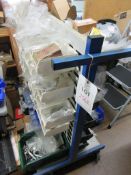Mobile double sided bin rack with contents including bolts, washers, pins, etc.