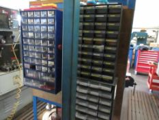 Three wall mounted multi drawer storage units with contents of assorted tip