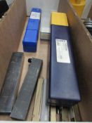 Tote box with contents including milling cutters