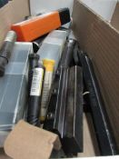 Tote box with contents including various milling cutters