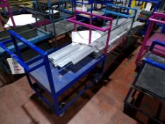 Three steel framed mobile trollies (excluding contents)