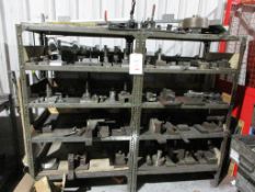 Two bays of stores racking and table with contents including various jigs, etc