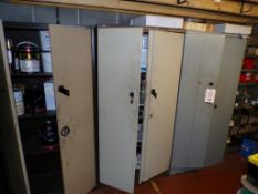 Three assorted steel twin door filing cabinets