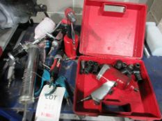 Assorted pneumatic hand tools including orbital sander, grease gun, spray guns, riveter, etc.