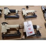 Four white pneumatic staplers