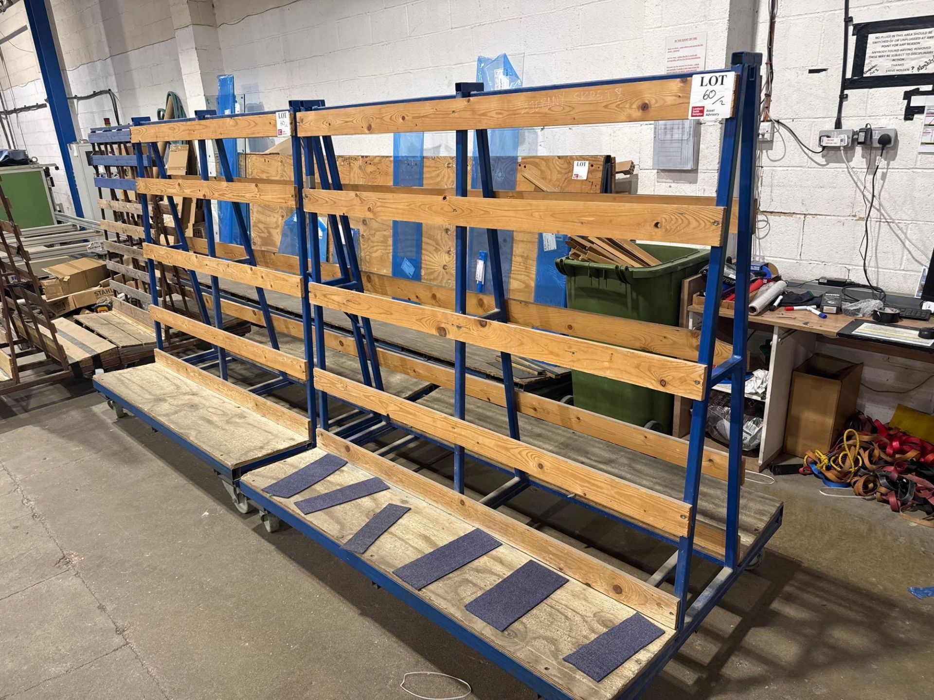 Two steel A frame mobile glass carts