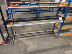 Free standing reel holder with manually operated cutter