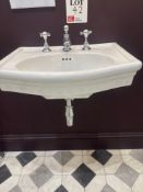 Wall mounted sink unit with taps
