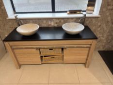 Marble topped twin sink unit with toilet as lotted