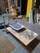 Small metal framed porters trolley and a large metal framed porters trolley