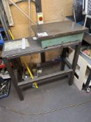 Metal surface block mounted to steel frame bench