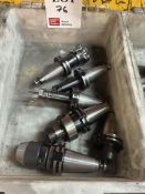 Six various BT40 quick change machining tool holders, complete with various cutting tools