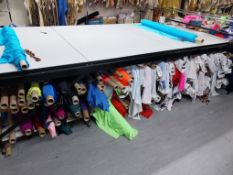 Printed lycra & stretch velvet fabric under cutting table (Friedmans / Funki Fabrics)