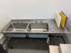 Twin basin sink unit with splash back.