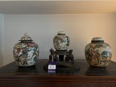 3 Satsuma Urns, one raised on a wooden stand depicting 3 Chinese dogs. Urn to right of photo shows s