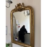 Framed artwork, wall mirror and vase