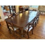 Oak extending dining table to include 3 extension leaves with set of 10 dining chairs. 3050mm x 1350