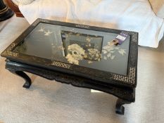 Oriental wooden glass topped coffee table with floral centre and mother of pearl detailing. 950mm x