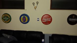 13 x wall signs comprising of 4 x bottle tops and 9 assorted alcohol tin signs – Located in bar