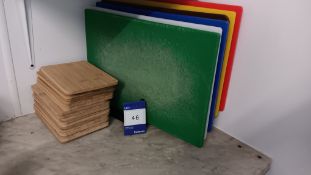 6 x Nylon chopping boards with rack and approx 10 wooden cutting boards with hanging hole –