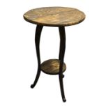 A Liberty & Co.–style Arts and Crafts occasional table, early 20th century. The circular top