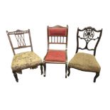 Three late Victorian and Edwardian nursing chairs, comprising a Chippendale Revival mahogany example