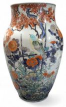 A Chinese ovoid vase, painted in polychrome with song bird, chrysanthemums, prunus and other