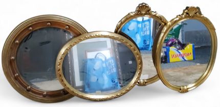 A pair of gilt oval mirrors, anthemion cresting, 60cm x 41cm;   others, circular, 58cm diam, etc (