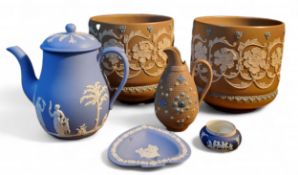 A pair of late 19th century Doulton Lambeth silicon ware jardinieres, in  relief  with scrolling