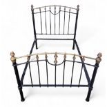 A 19th century cast iron and brass small double bed frame, polished turned brass finials, 145cm