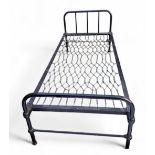 A Victorian cast iron bed frame, possibly a prison/hospital bed, painted black, 84cm high, 93cm