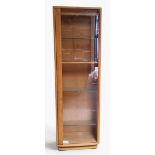 An Ercol Windsor display cabinet, adjustable shelves, glass single door,  approximately 153cm