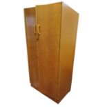 A mid 20th century E. Gomme/G-Plan Brandon range oak double door wardrobe,  wooden pull handles,