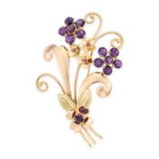 TIFFANY & CO., A RETRO AMETHYST AND RUBY FLORAL SPRAY BROOCH in 14ct yellow and rose gold,