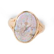 A RARE ANTIQUE OPAL INTAGLIO POISON RING in high carat yellow gold, the hinged face opening to