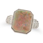 AN OPAL AND DIAMOND DRESS RING in platinum, set with an octagonal shaped cabochon opal, the