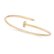 CARTIER, A DIAMOND JUSTE UN CLOU BRACELET / BANGLE in 18ct yellow gold, the flexible body designed