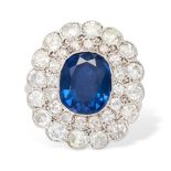 A FINE ANTIQUE SAPPHIRE AND DIAMOND CLUSTER RING, EARLY 20TH CENTURY set with a cushion cut sapphire