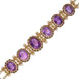 AN ANTIQUE FRENCH AMETHYST AND PEARL BRACELET in 18ct yellow gold, set with a row of oval cut