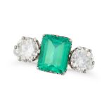 A COLOMBIAN EMERALD AND DIAMOND THREE STONE RING set with an octagonal step cut emerald of 1.88 cara
