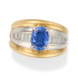 A SAPPHIRE AND DIAMOND DRESS RING set with an oval cut sapphire of 1.98 carats accented by a row