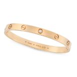 CARTIER, A DIAMOND LOVE BANGLE in 18ct rose gold, the screw motifs punctuated by a single round bril