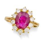 NO RESERVE - A RUBY AND DIAMOND CLUSTER RING in 18ct yellow gold, set with an oval cut ruby of appro