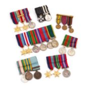 A GROUP OF MOUNTED MINIATURE MEDAL GROUPS