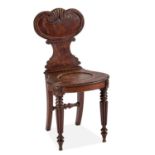 A 19TH CENTURY OAK HALL CHAIR IN THE MANNER OF GILLOWS