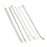 A COLLECTION OF SILVER GEM-SET TENNIS BRACELETS