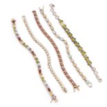 A COLLECTION OF SILVER GEM-SET TENNIS BRACELETS