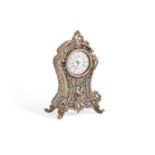 A SMALL CONTINENTAL SILVER AND MOTHER-OF-PEARL DESK CLOCK IN THE ROCOCO TASTE
