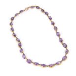 A LATE VICTORIAN AMETHYST RIVIERE NECKLACE