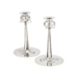 A PAIR OF CYMRIC SILVER CANDLESTICKS ATTRIBUTED TO ARCHIBALD KNOX (1864-1933)